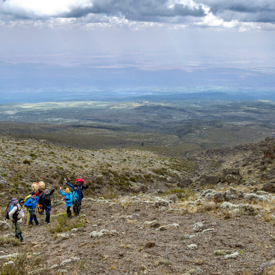 trekkers taking a snack break on kilimanjaro