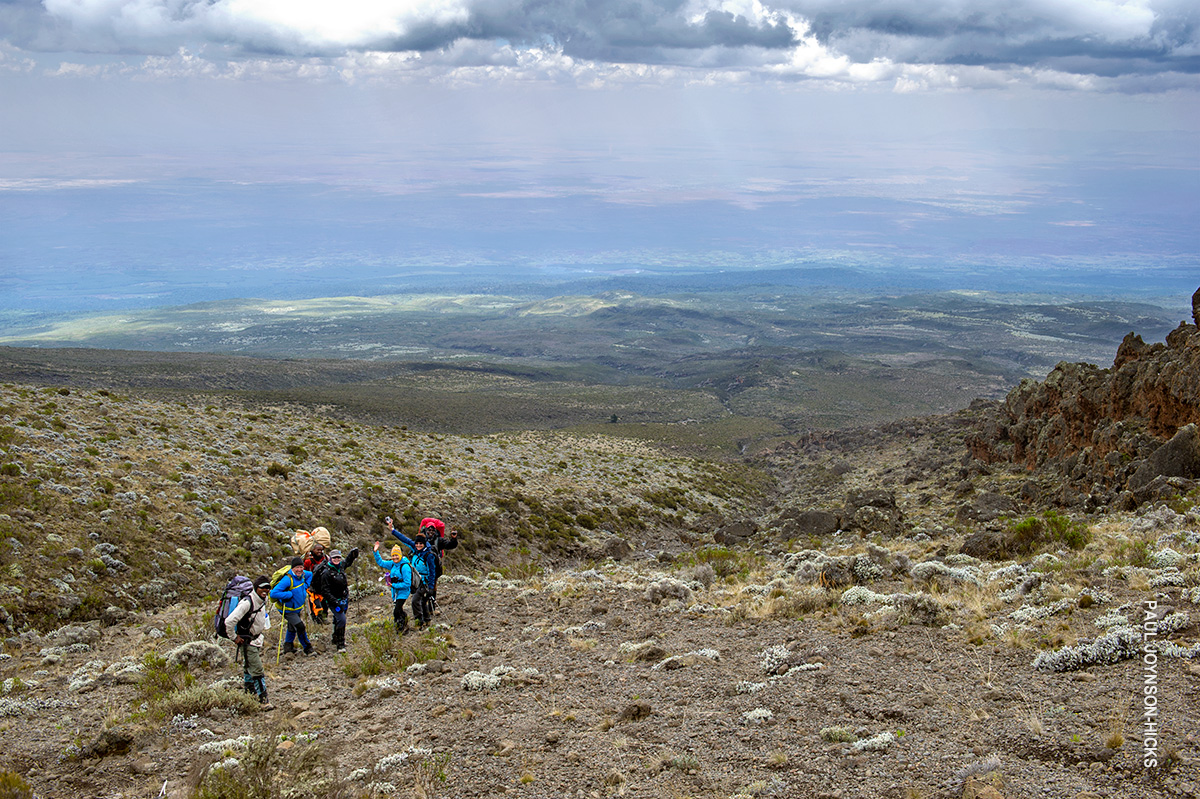 trekkers taking a snack break on kilimanjaro